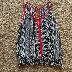 Black and white printed top with red trim